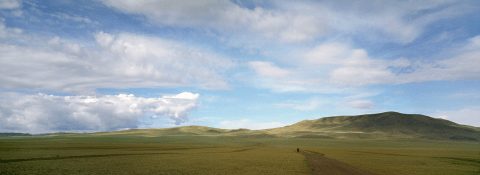 Biker in Mongolian steppe